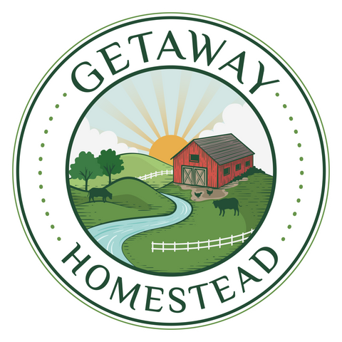 Logo of Getaway Homestead with a red barn, sun, and landscape.